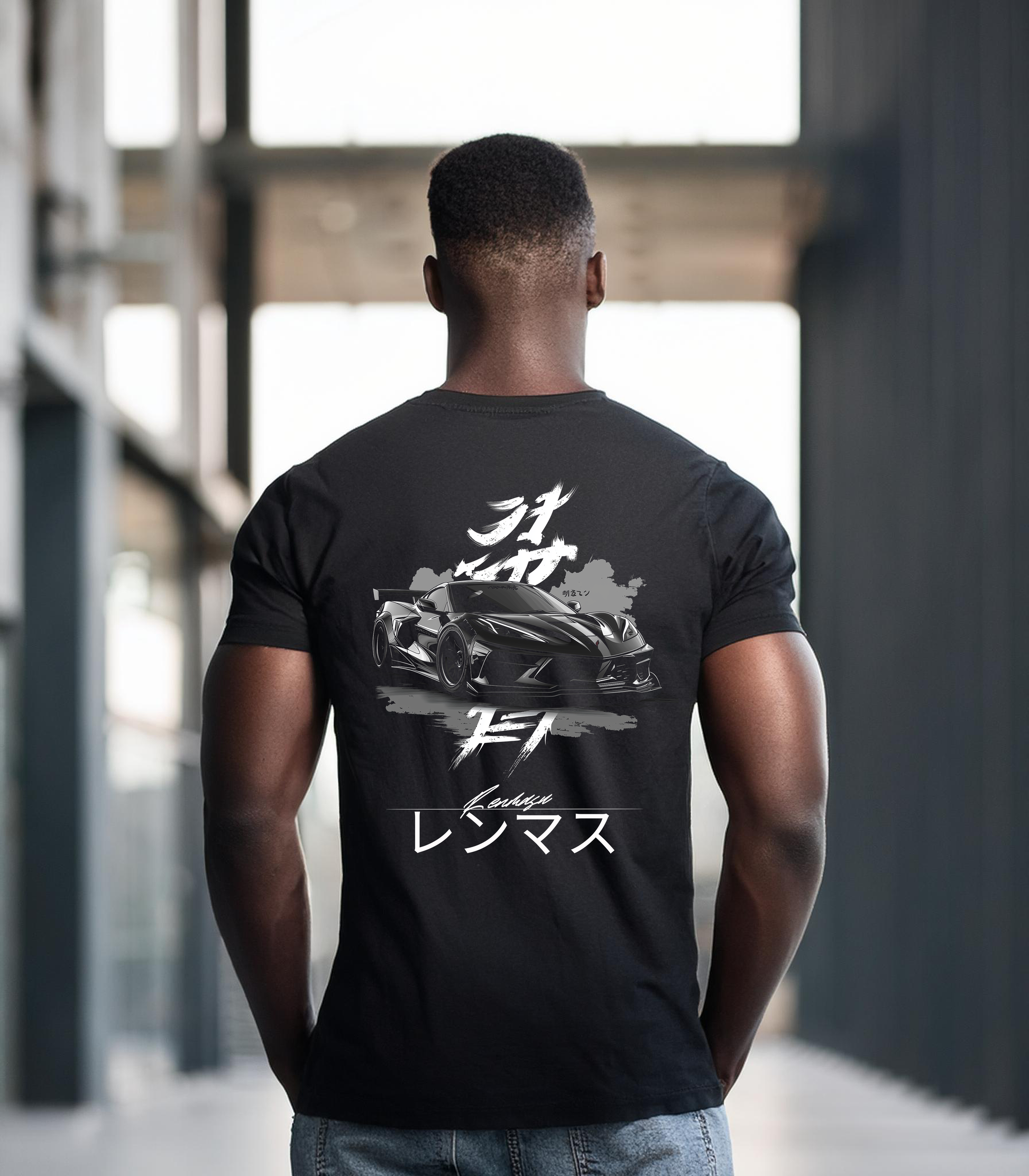 Man wearing the C8 Corvette Specter Tee by Renmasu, featuring a sleek black C8 Corvette design with Japanese text on a black premium cotton t-shirt.